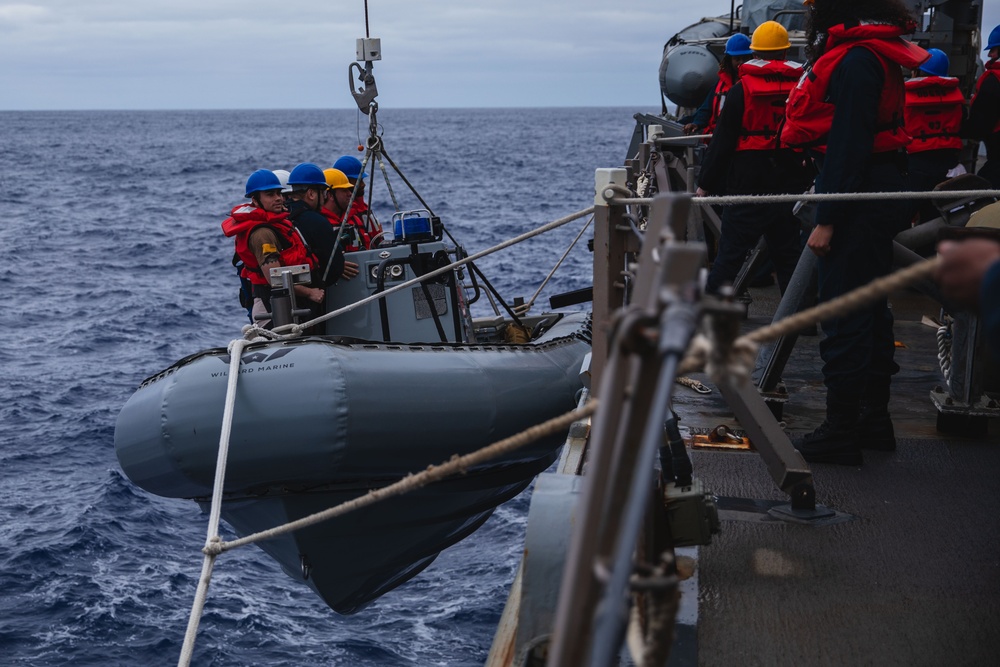 USS John S. McCain conduct small boat operations