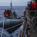 USS John S. McCain conduct small boat operations