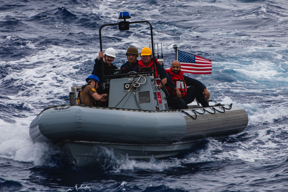 USS John S. McCain conduct small boat operations