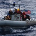 USS John S. McCain conduct small boat operations