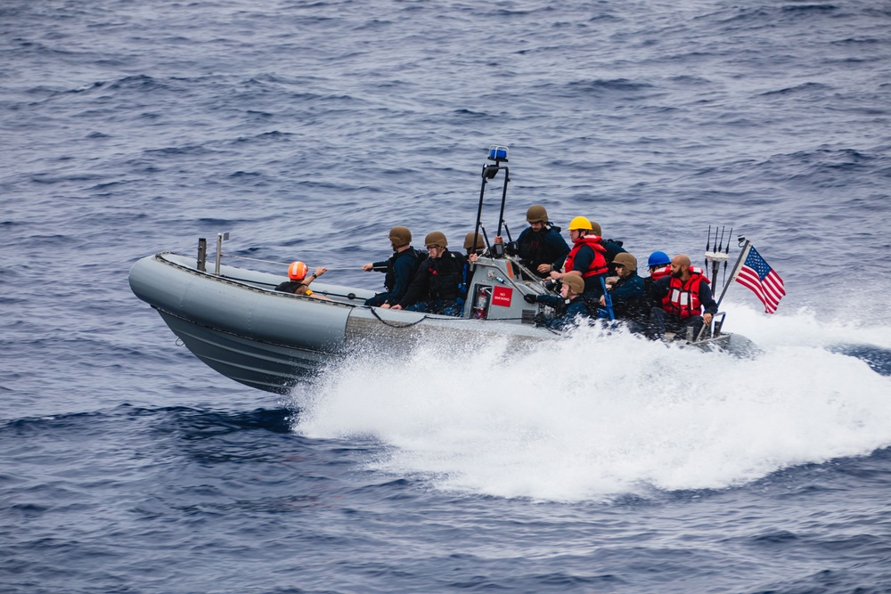 USS John S. McCain conduct small boat operations