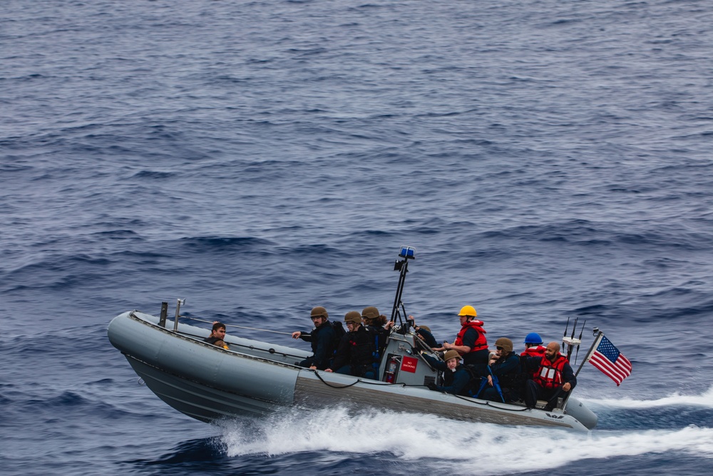 USS John S. McCain conduct small boat operations