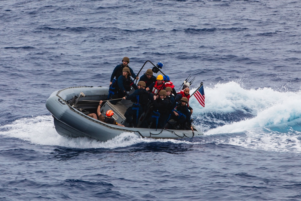 USS John S. McCain conduct small boat operations