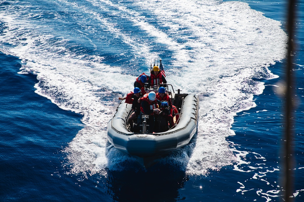 USS John S. McCain conduct small boat operations