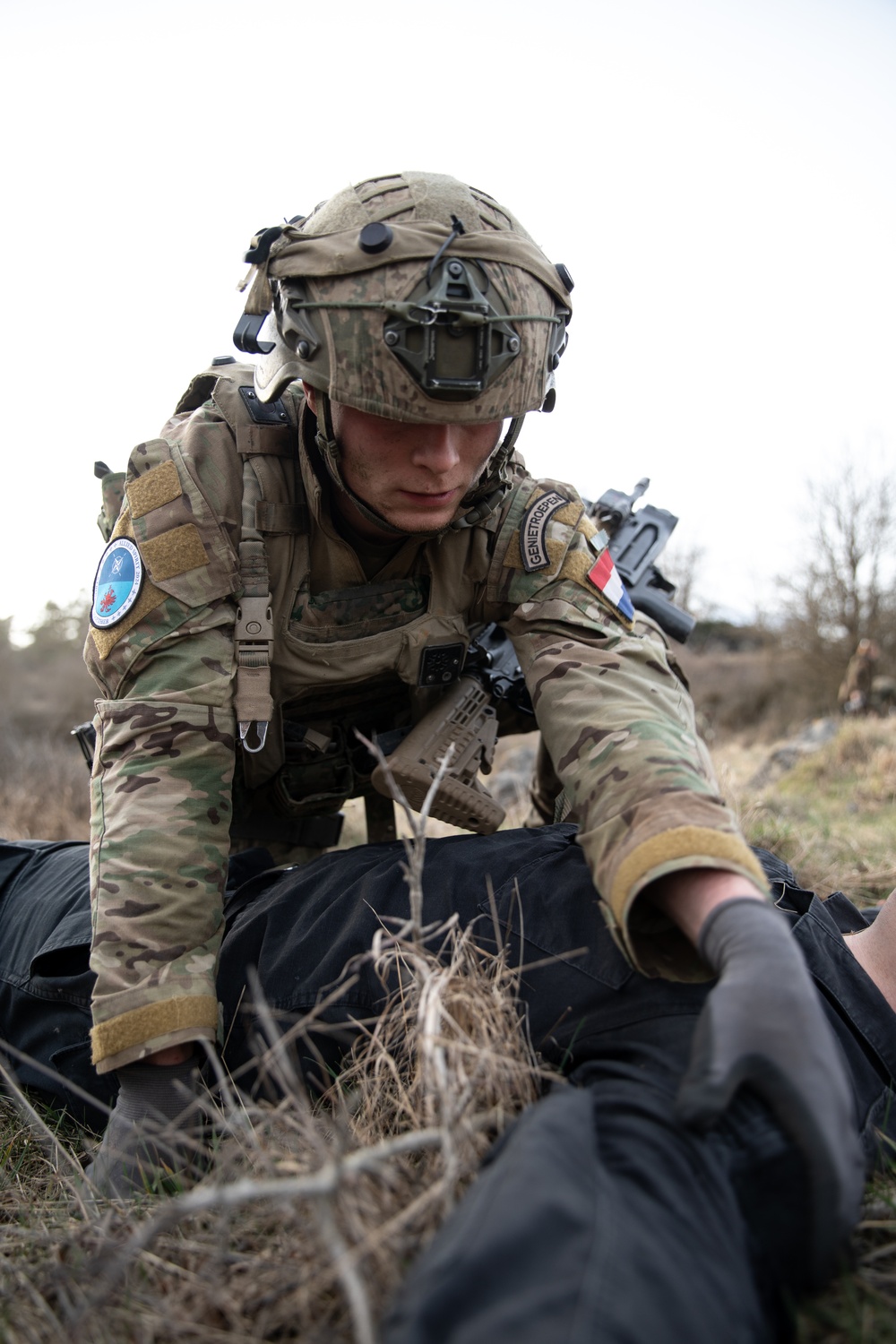 Dutch Soldier Conducts A Search On Enemy Casuality During Allied Spirit 24