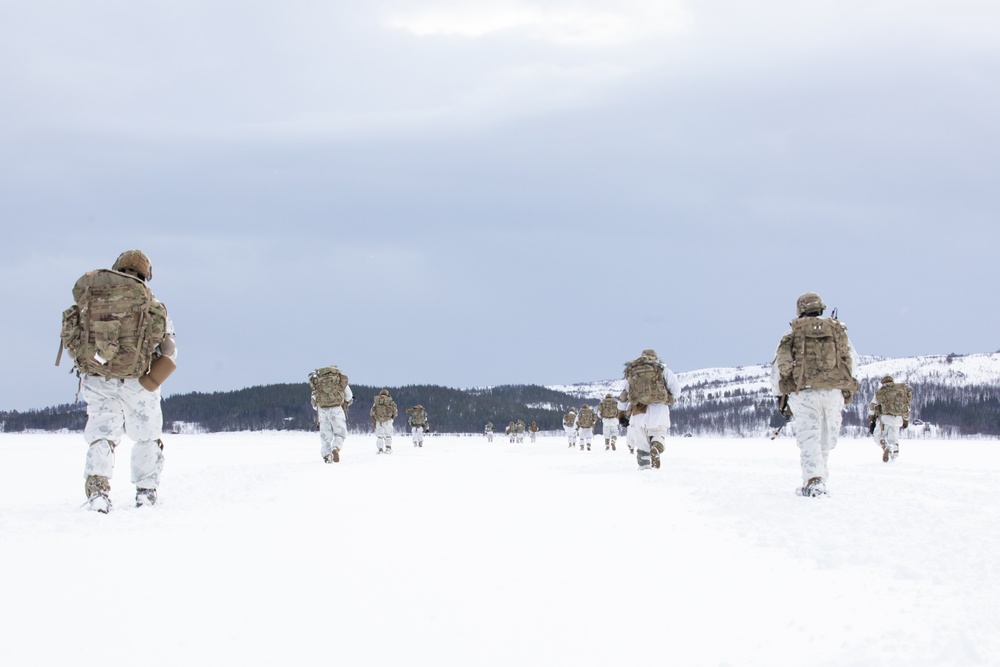 Arctic Angels Snowshoe Over Lake