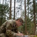 Soldiers conduct land navigation during the SETAF-AF Best Squad Competition