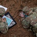 Soldiers conduct land navigation during the SETAF-AF Best Squad Competition