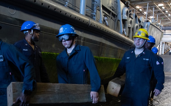 USS San Diego, Naval Beach Group 1 secure landing craft utility with wooden shoring