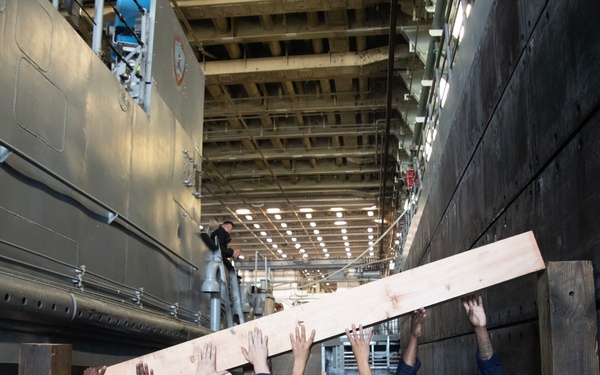 USS San Diego, Naval Beach Group 1 secure landing craft utility with wooden shoring
