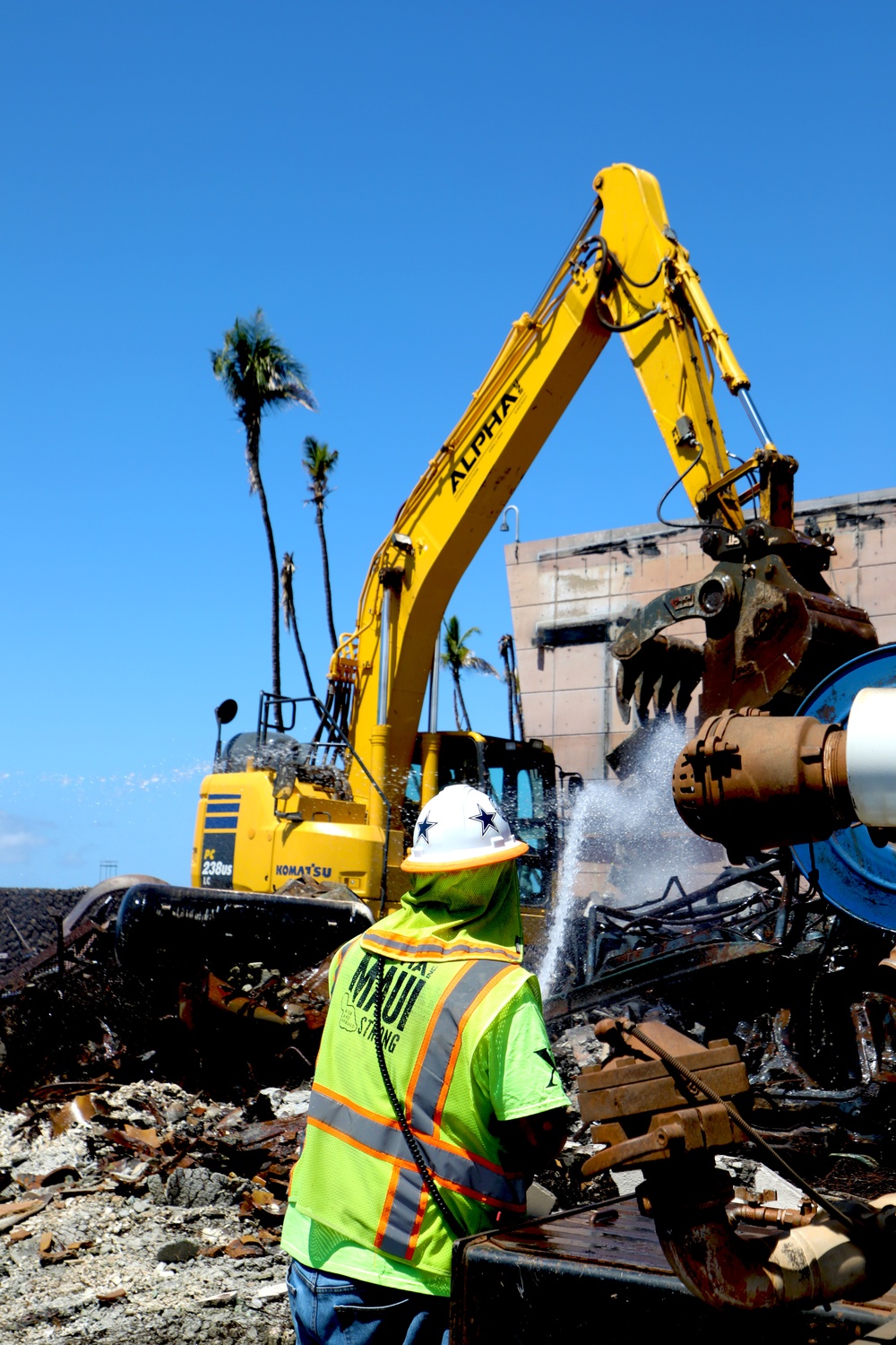 Debris removal at a property impacted by the Hawai’i Wildfires