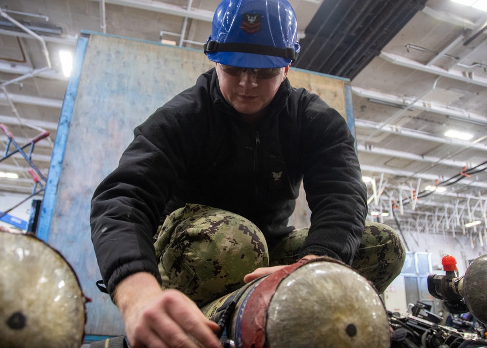 USS Ronald Reagan (CVN 76) Sailors perform SCBA maintenance