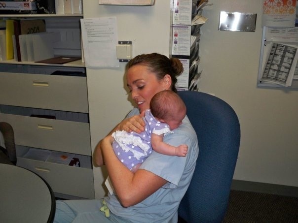Lt. Merritt holds baby she delivered