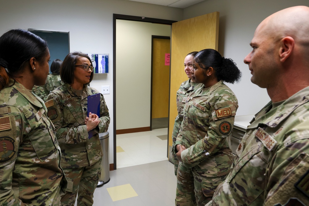 Lt. Col. Merritt consults with 9MDG active-duty clinic Airmen