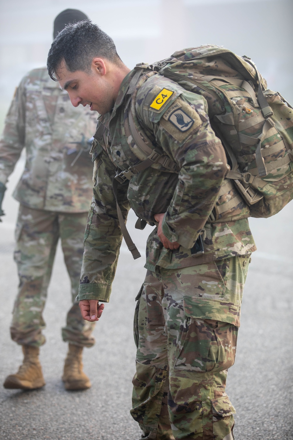 Soldiers compete in a 12-mile ruck march during the SETAF-AF Best Squad Competition