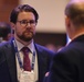 Matthew Loftus meets with visitors to the FEHRM kiosk at the HIMSS Conference