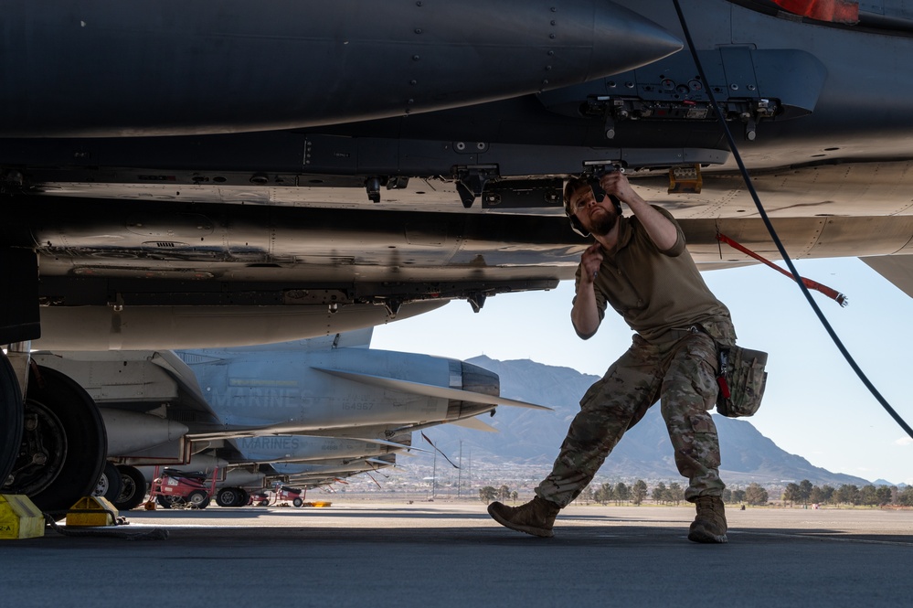 Airmen load GBU-38s on F-15E Strike Eagle during Red Flag-Nellis 24-2