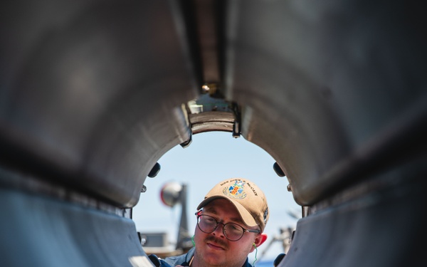 Sailor conducts maintenance on SVTT