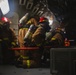 Sailors battle a simulated fire during a general quarters drill