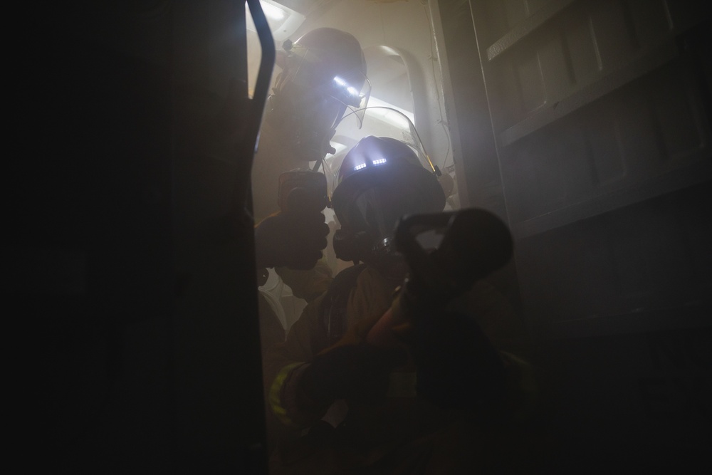 Sailors battle a simulated fire during a general quarters drill