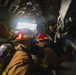 Sailors battle a simulated fire during a general quarters drill