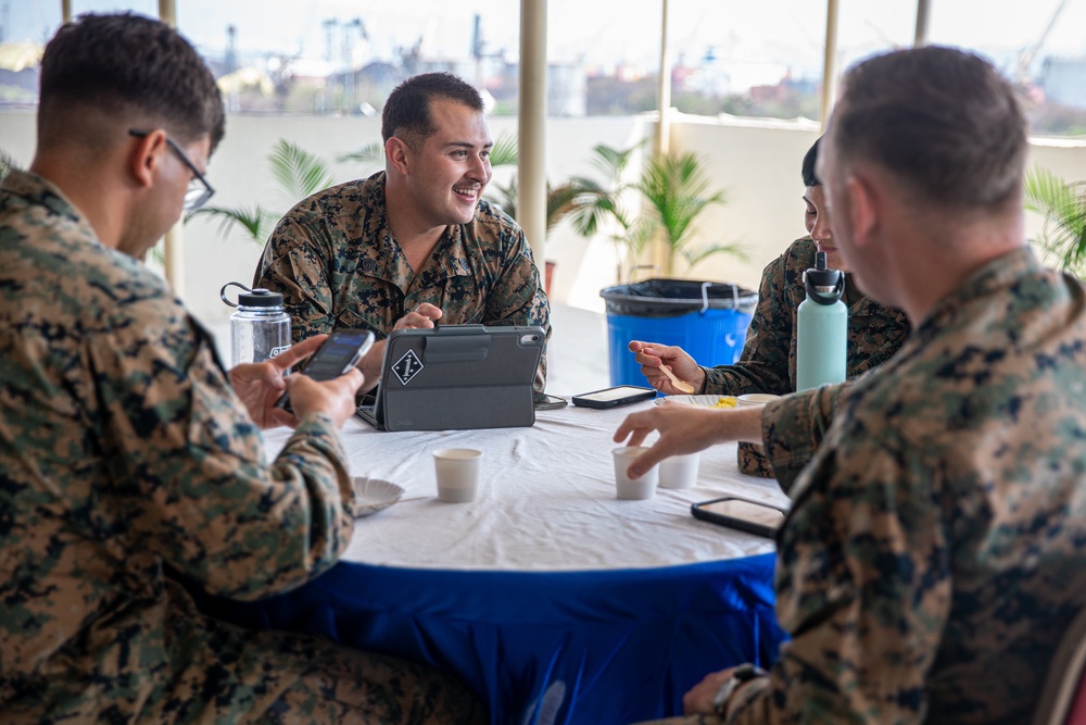 U.S. and Indian service members socialize at tea time during Exercise Tiger TRIUMPH 2024
