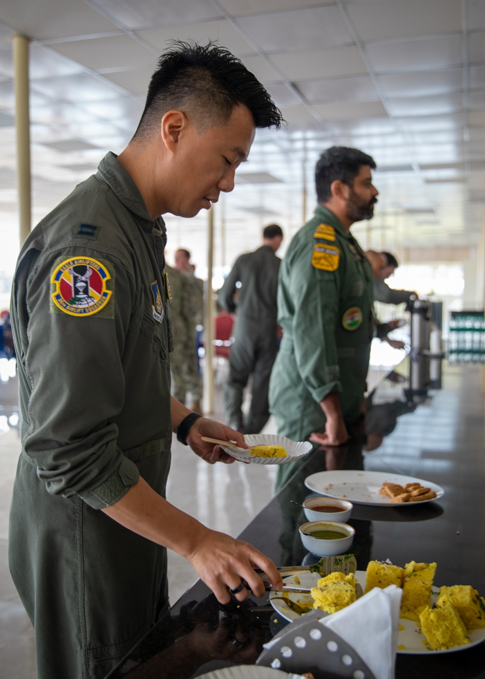 U.S. and Indian service members socialize at tea time during Exercise Tiger TRIUMPH 2024
