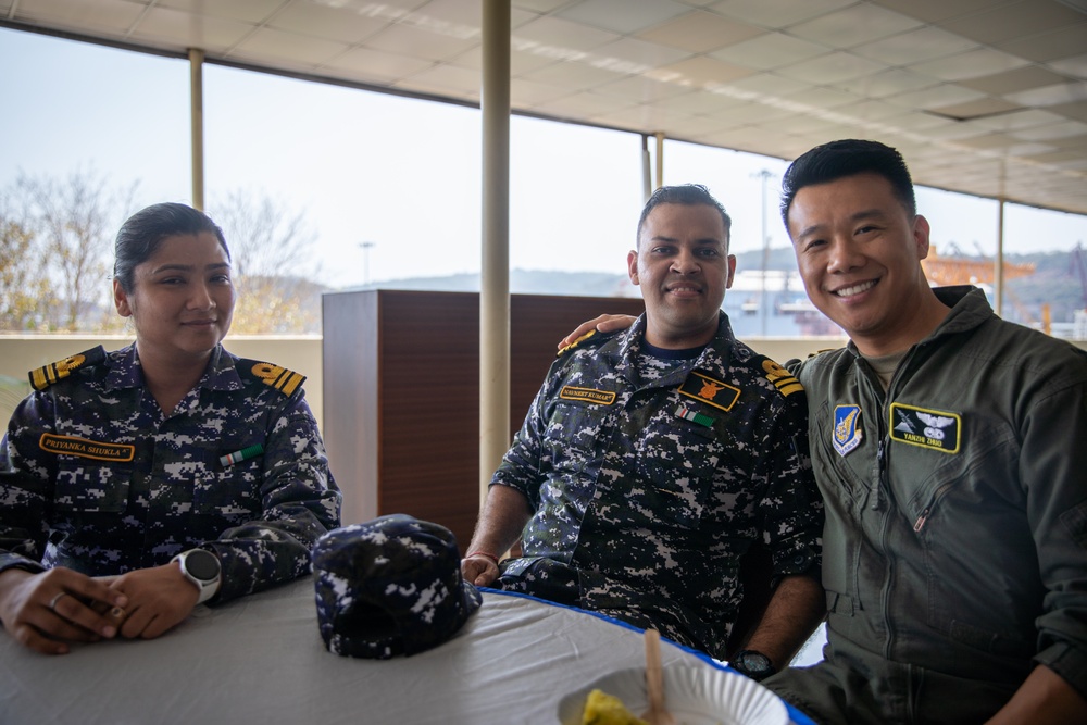 U.S. and Indian service members socialize at tea time during Exercise Tiger TRIUMPH 2024