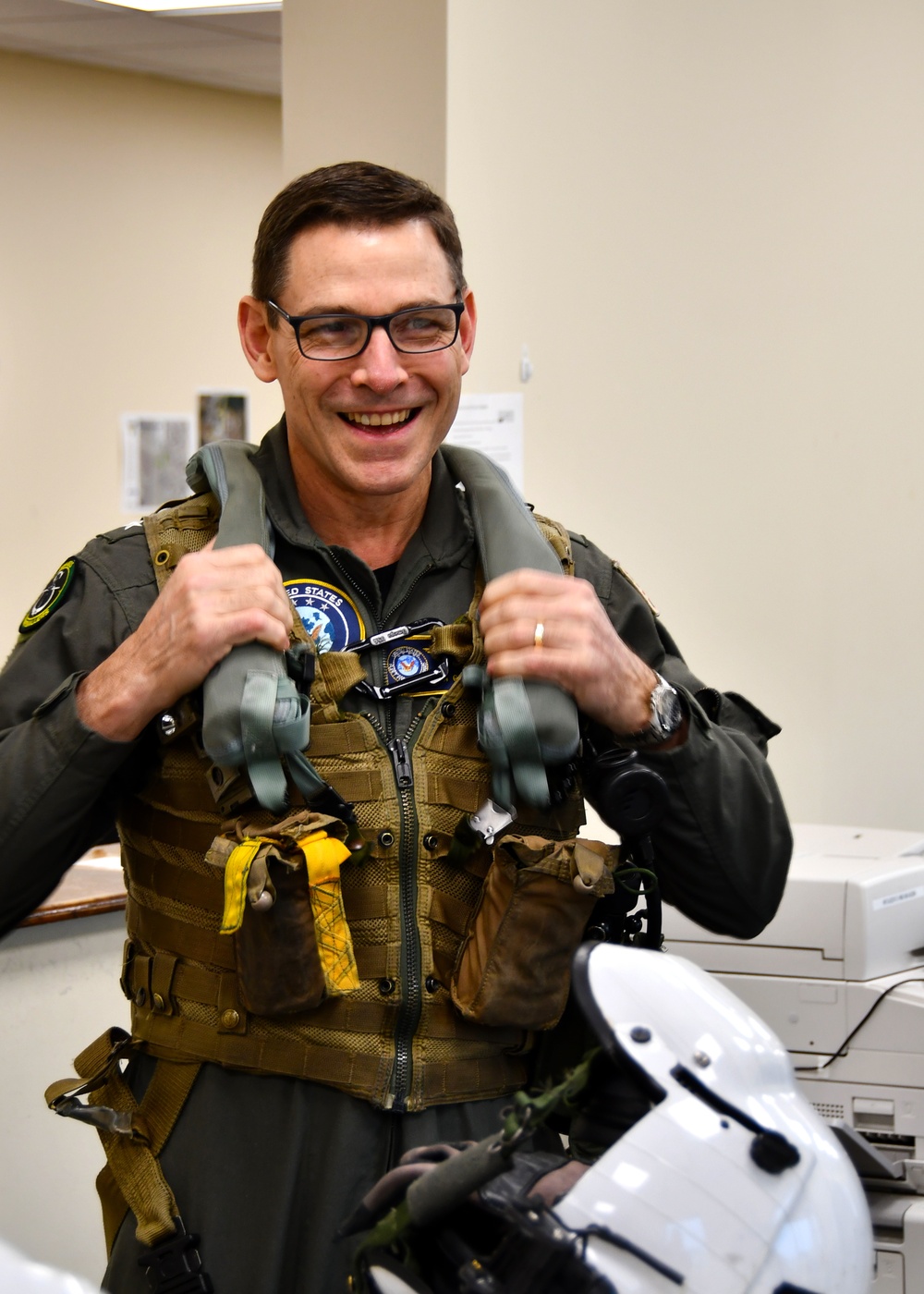 Vice Adm. John Gumbleton, commander, Task Force 80 and deputy commander, U.S. Fleet Forces, receives gear in preparation for a TH-73A Thrasher familiarization flight