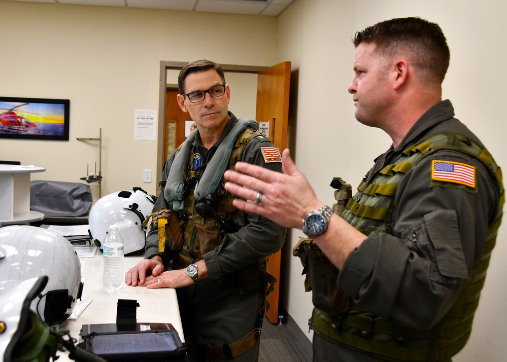 Vice Adm. John Gumbleton, commander, Task Force 80 and deputy commander, U.S. Fleet Forces, completes a pre-flight brief in preparation for a TH-73A Thrasher familiarizatio