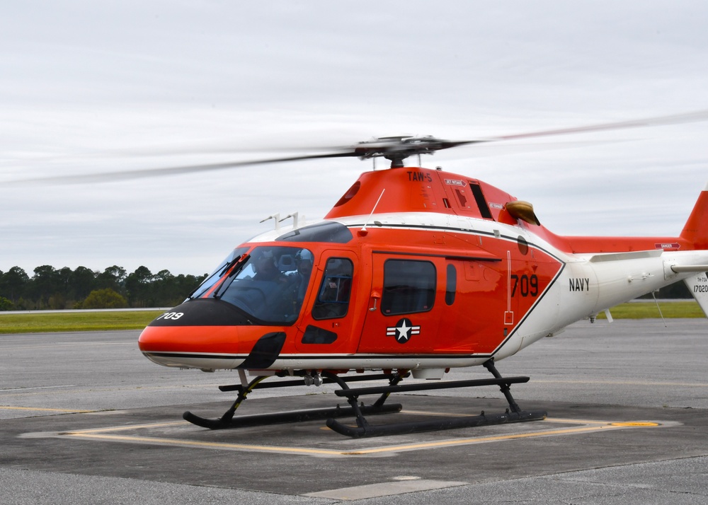 Milton, Fla. – Vice Adm. John Gumbleton, commander, Task Force 80 and deputy commander, U.S. Fleet Forces, and Lt. Cmdr. Ryan Ross, Helicopter Instructor Training Unit (HITU) Instructor Pilot take off Mar 22 for Navy Outlying Landing Field Spencer.