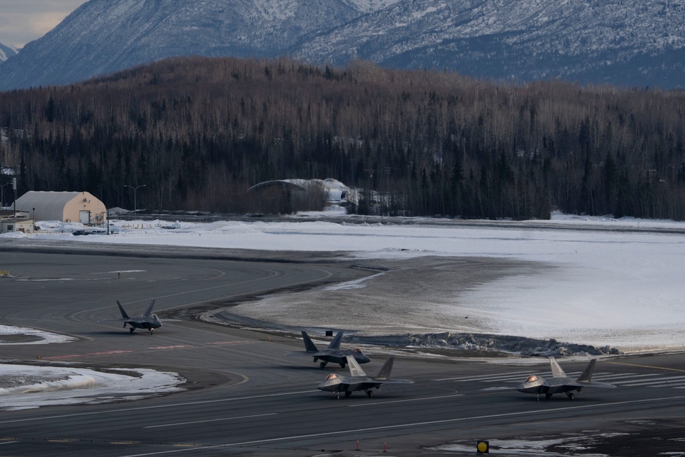 3rd Wing conducts a missing man formation flyover in remembrance of Staff Sgt. Charles A. Crumlett