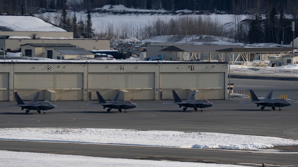 3rd Wing conducts a missing man formation flyover in remembrance of Staff Sgt. Charles A. Crumlett