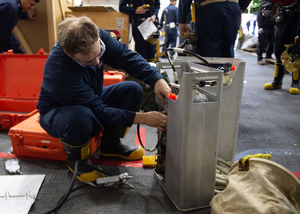 USS Ronald Reagan (CVN 76) Sailors conduct flying squad drill