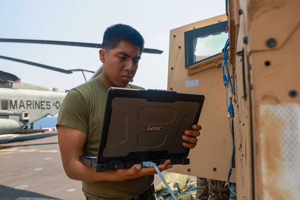 Marines Check Comms Aboard USS Somerset