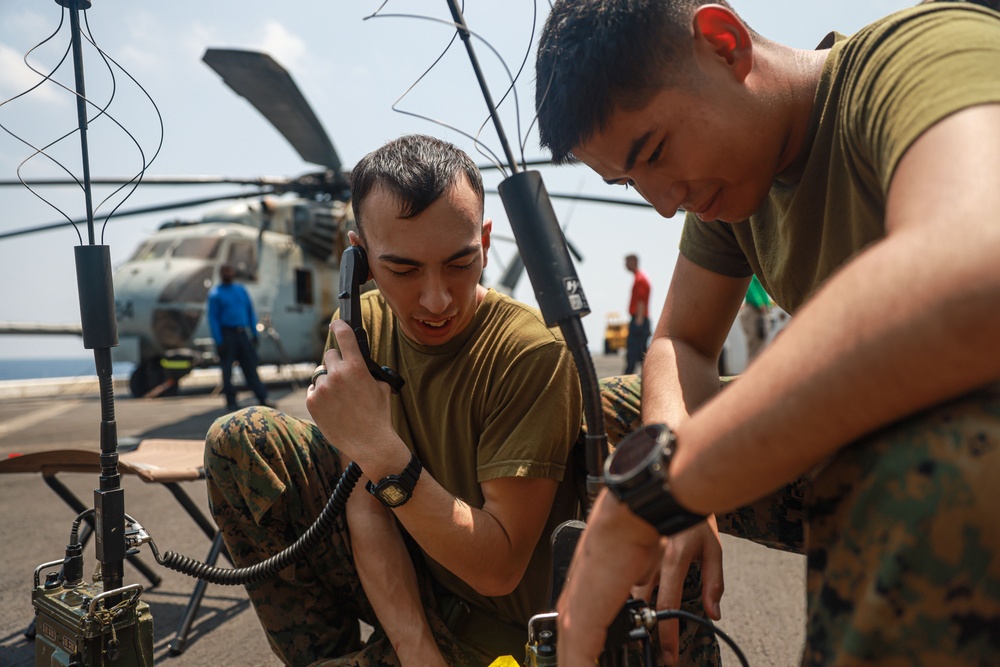 Marines Check Comms Aboard USS Somerset