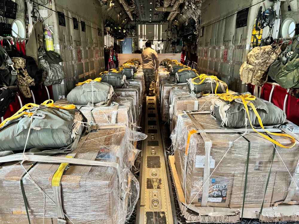 Airmen load Jordanian humanitarian aid onto AFCENT HC-130s for Gaza