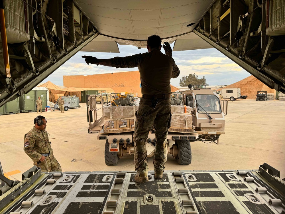 Airmen load Jordanian humanitarian aid onto AFCENT C-130s for Gaza