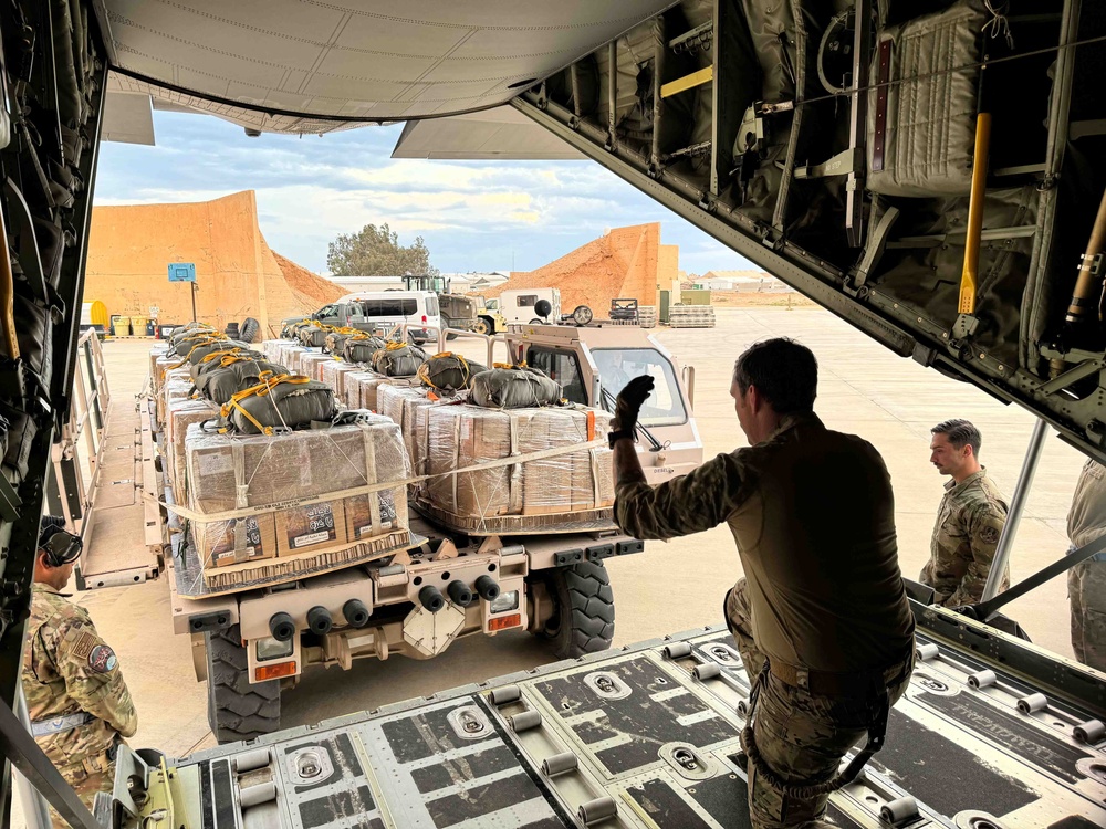 Airmen load Jordanian humanitarian aid onto AFCENT C-130s for Gaza