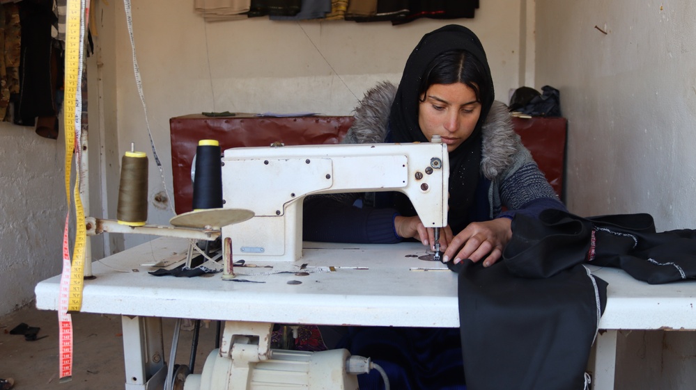 USAID/Syria’s Syria Livelihoods Program intern working at a tailoring and textile workshop in Hasakah.