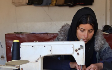 USAID/Syria’s Syria Livelihoods Program intern working at a tailoring and textile workshop in Hasakah.