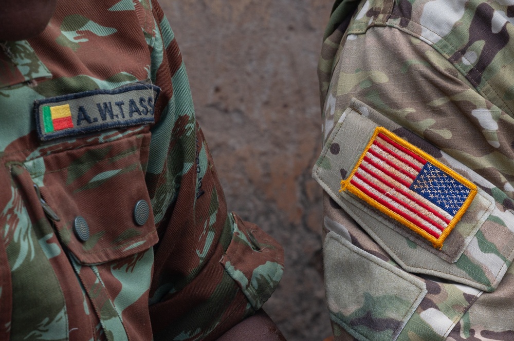 U.S. Army soldiers with the 91st Civil Affairs Battalion deployed with Special Operations Command Africa, conduct a civil engagement with Forces des Armées Beninoises members