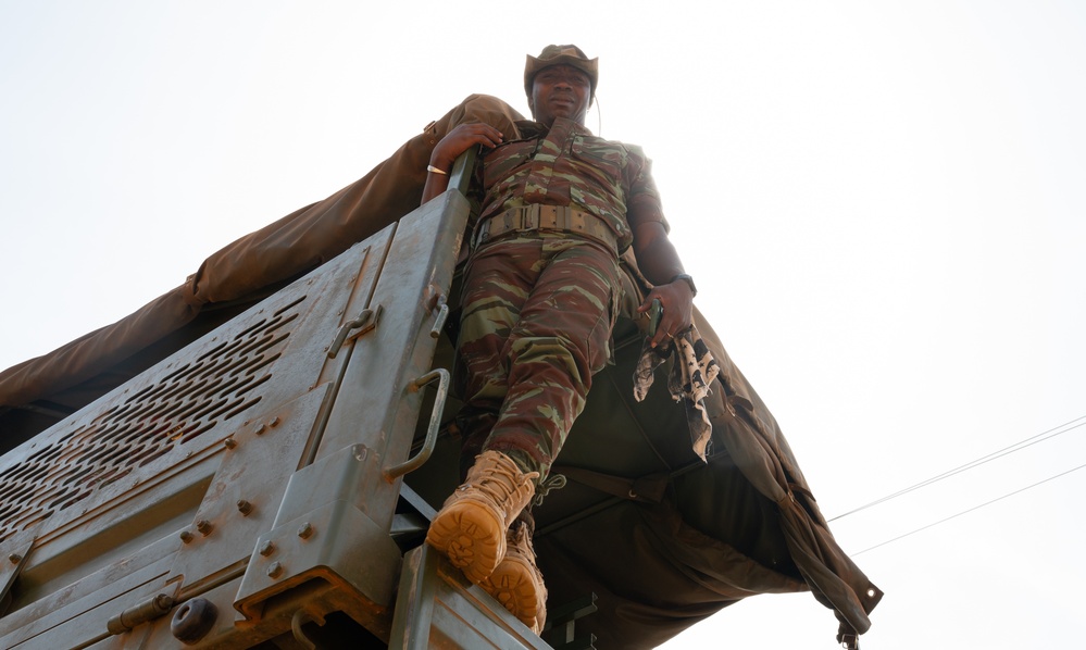 U.S. Army soldiers with the 91st Civil Affairs Battalion deployed with Special Operations Command Africa, conduct a civil engagement with Forces des Armées Beninoises members