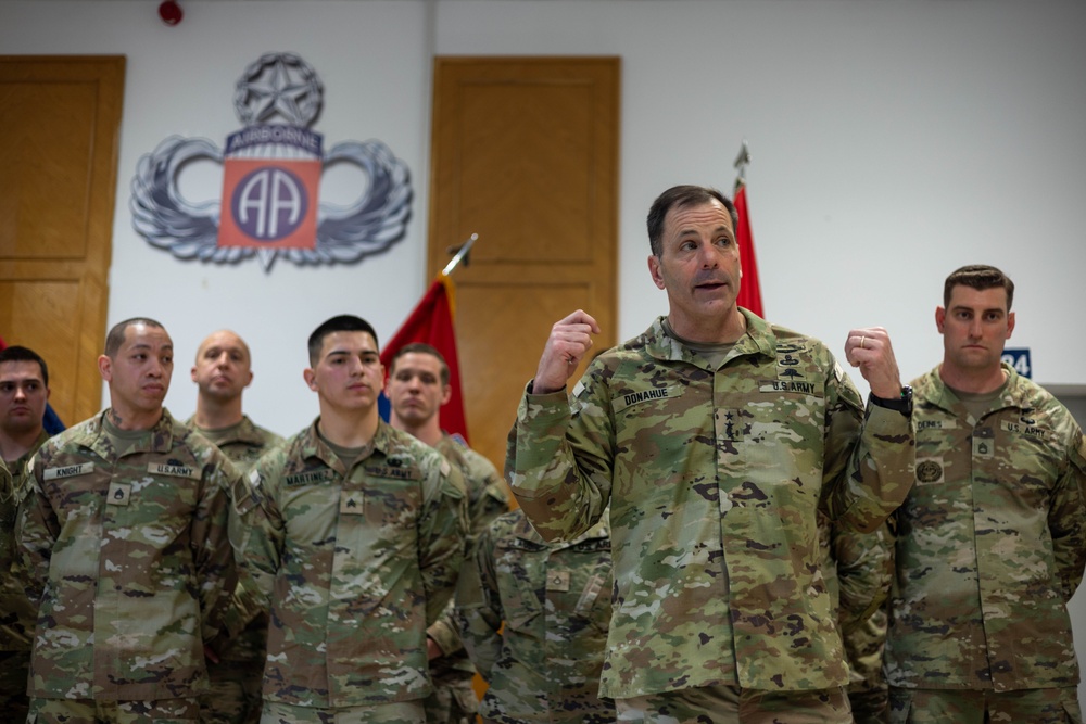 Lt. Gen. Christopher Donahue awards Soldiers with Challenge Coin