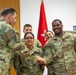 Lt. Gen. Chistopher Donahue awards Soldiers with a Challenge Coin