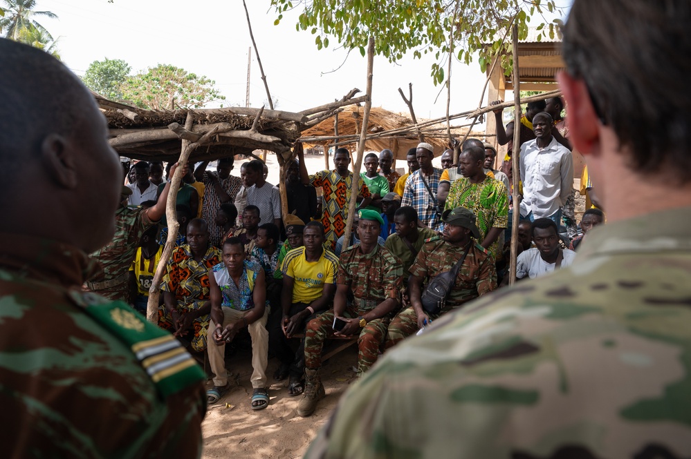 U.S. Army soldiers with the 91st Civil Affairs Battalion deployed with Special Operations Command Africa, conduct a civil engagement with Forces des Armées Beninoises members