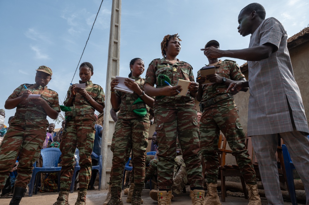 U.S. Army soldiers with the 91st Civil Affairs Battalion deployed with Special Operations Command Africa, conduct a civil engagement with Forces des Armées Beninoises members