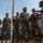 U.S. Army soldiers with the 91st Civil Affairs Battalion deployed with Special Operations Command Africa, conduct a civil engagement with Forces des Armées Beninoises members