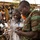 U.S. Army soldiers with the 91st Civil Affairs Battalion deployed with Special Operations Command Africa, conduct a civil engagement with Forces des Armées Beninoises members