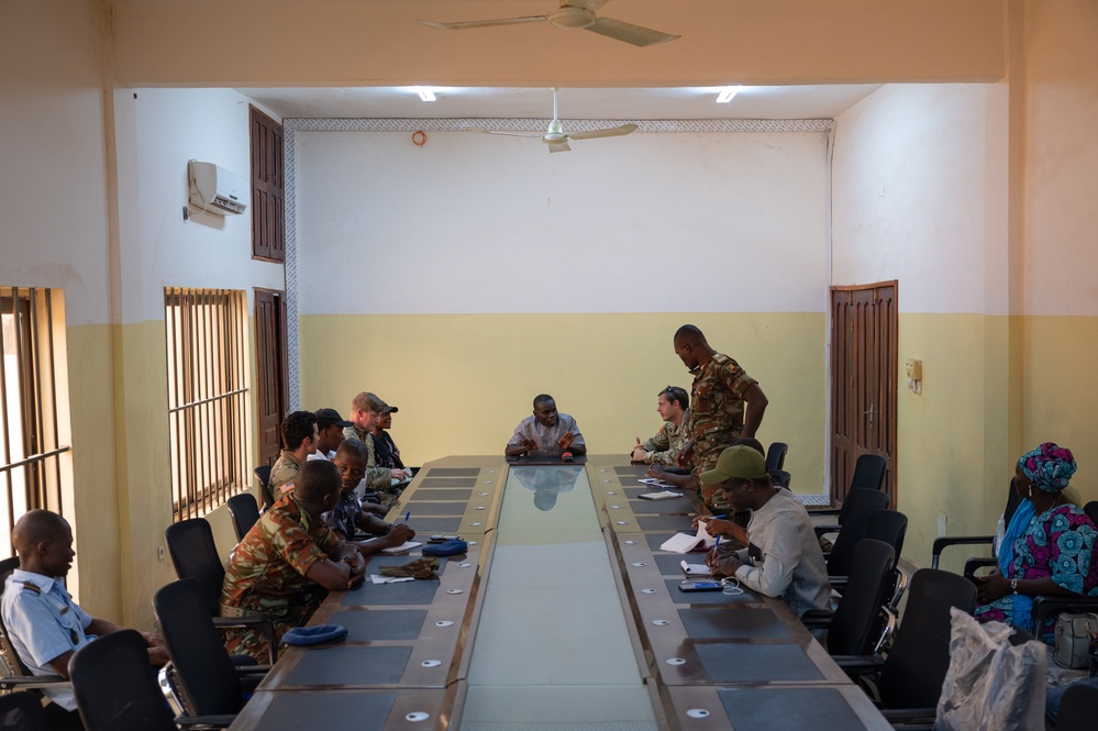 U.S. Army soldiers with the 91st Civil Affairs Battalion deployed with Special Operations Command Africa, conduct a civil engagement with Forces des Armées Beninoises members